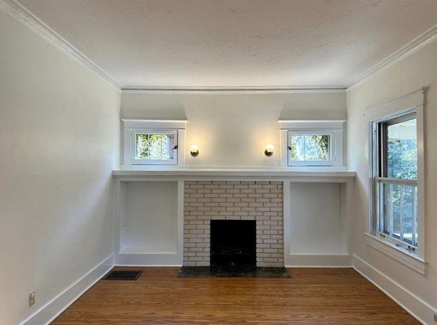 living room with brick fireplace