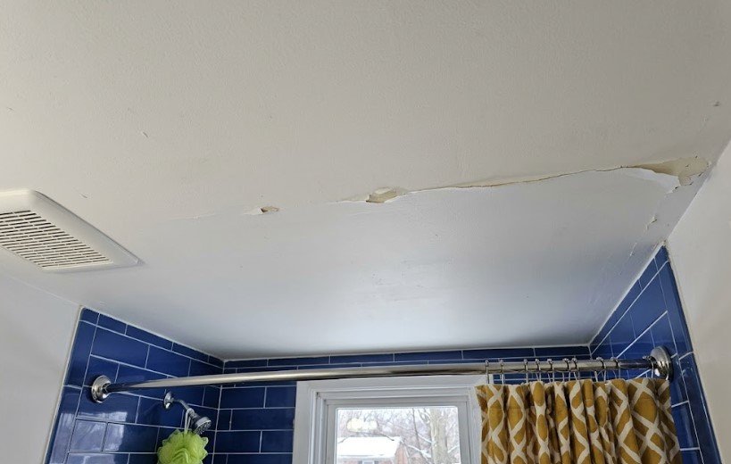 Paint Peeling in Bathroom Ceiling? In KY, Winter Steam Is Mostly Why 1 Paint peeling in a line across a bathroom ceiling above a blue-tiled shower, with snow outside the window
